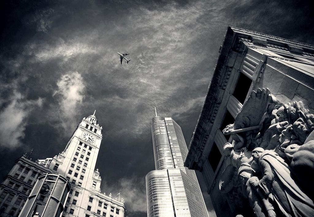 An airplane flying over a city, symbolizing FAA's involvement with 5G networks