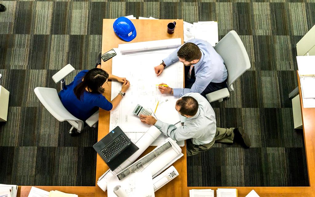 Board meeting discussing digital strategy at a charity
