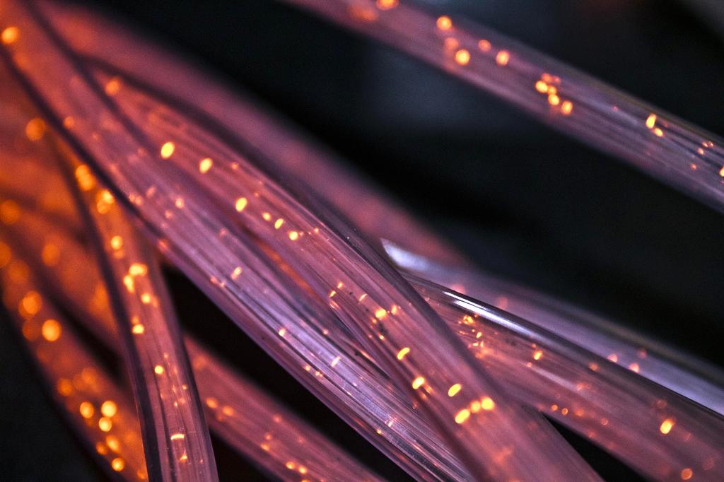 Close-up of a fiber optic cable representing low-attenuation transmission media